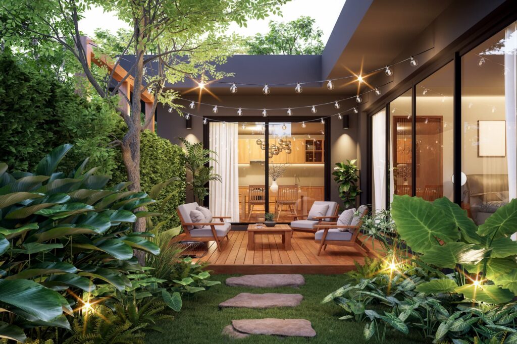 outdoor patio with beautiful folliage and outdoor lighting